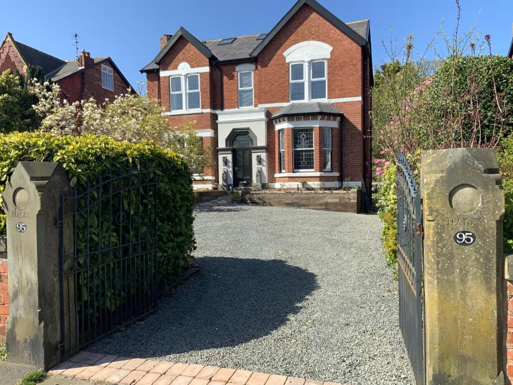 a gate in front of a brick house at The Dales in Marshside