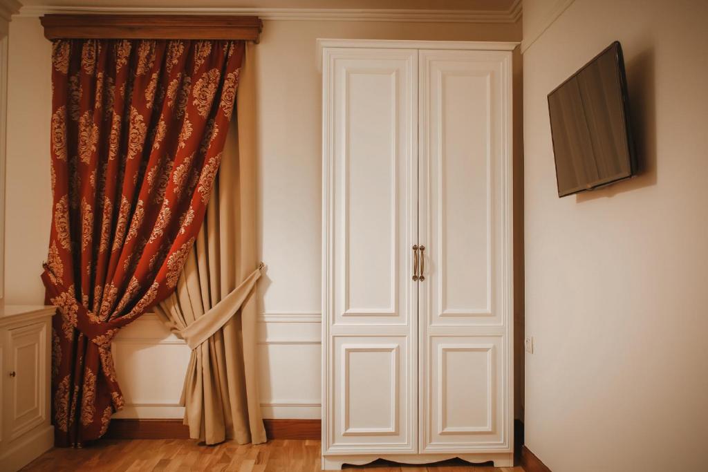 TV a/nebo společenská místnost v ubytování Hotel Opera