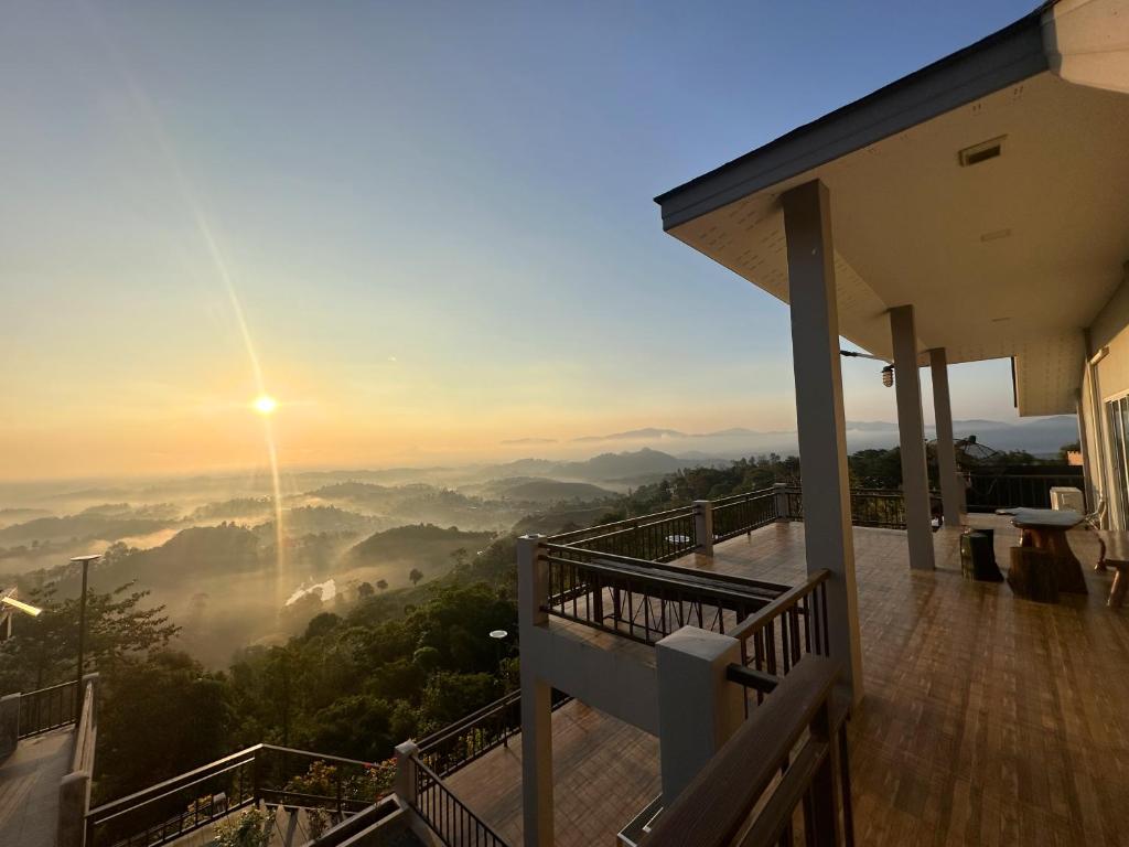 a house balcony with a view of the mountains at Tsuya Hill Private Mountain View Villa, Chiang Rai in Mae Chan