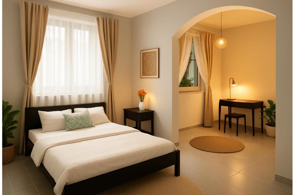 a bedroom with a bed with a desk and a window at AltstadtNest Hannover in Hannover