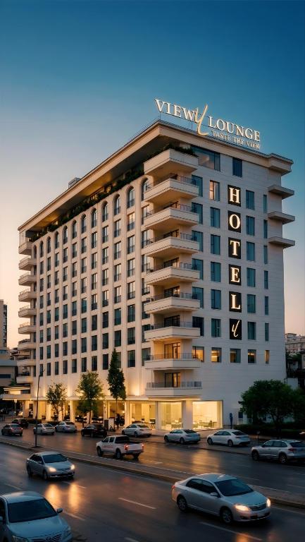 a large building with a sign on top of it at View Lounge Hotel in As Sulaymānīyah