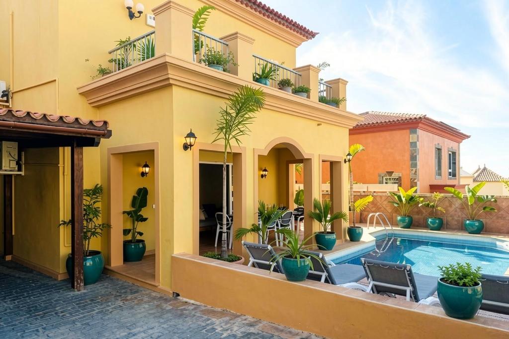 a house with a swimming pool in front of it at Villa Chayofa in Chayofa