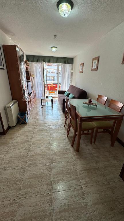 a living room with a couch and a table at Apartamento La Ojerada in Ajo