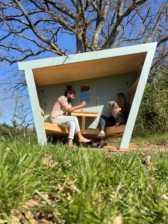 a couple of people sitting in a shed at Cabane étape in Idrac-Respailles