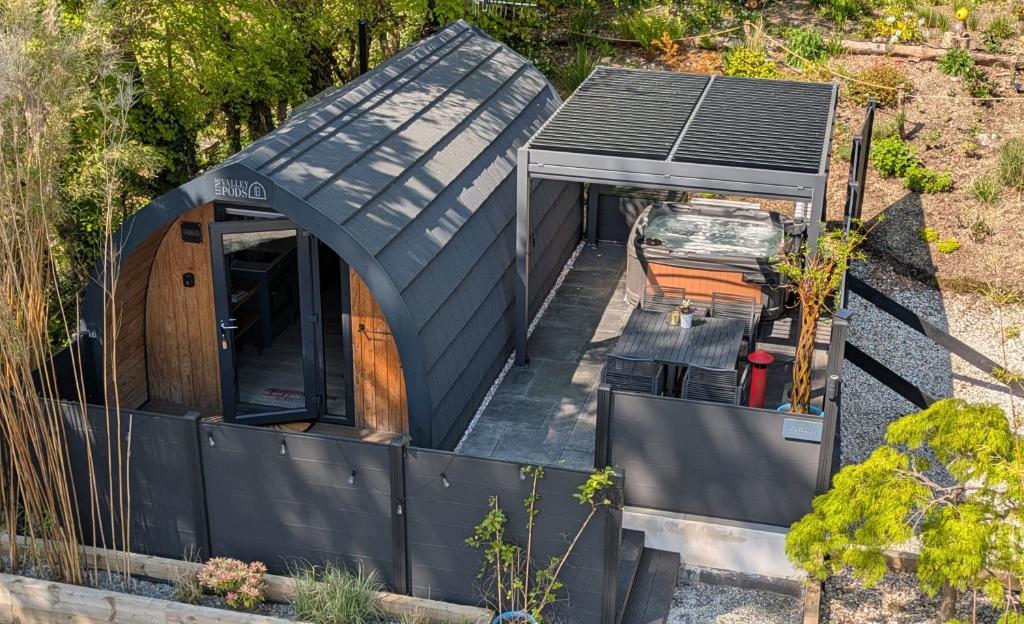 an overhead view of a tiny house with a black roof at Beach House Pods in Dunoon