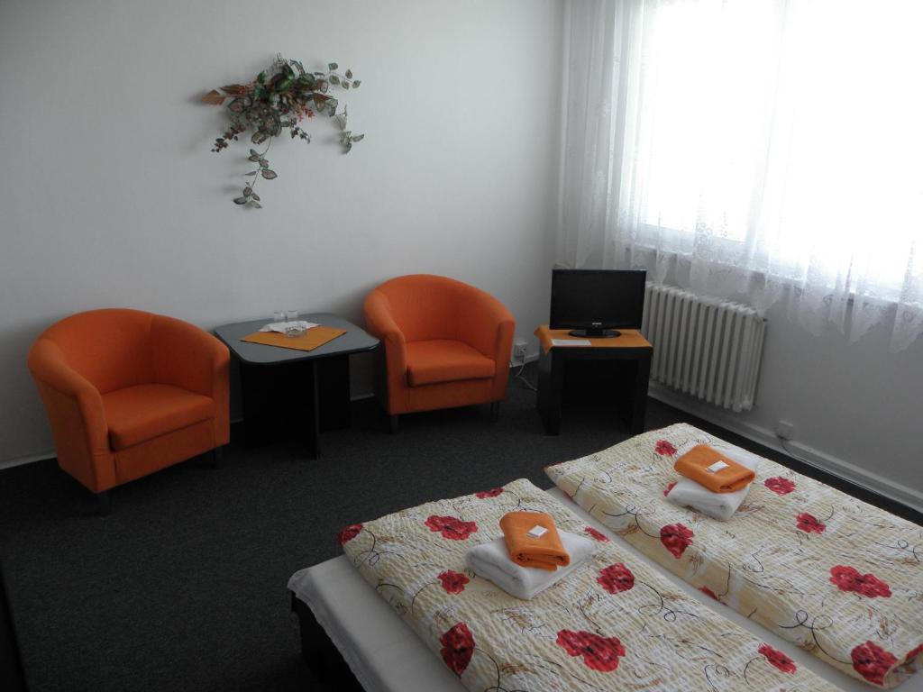 Postel nebo postele na pokoji v ubytování Hotel Milotel