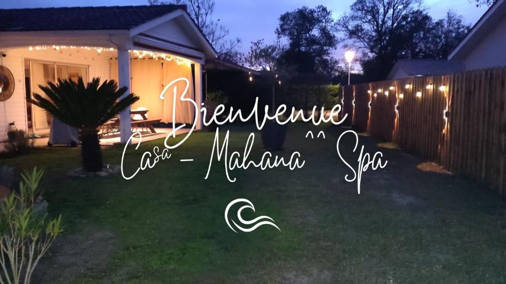 a house with a yard with a fence with lights at Casa Mahana spa in Saugnacq-et-Muret