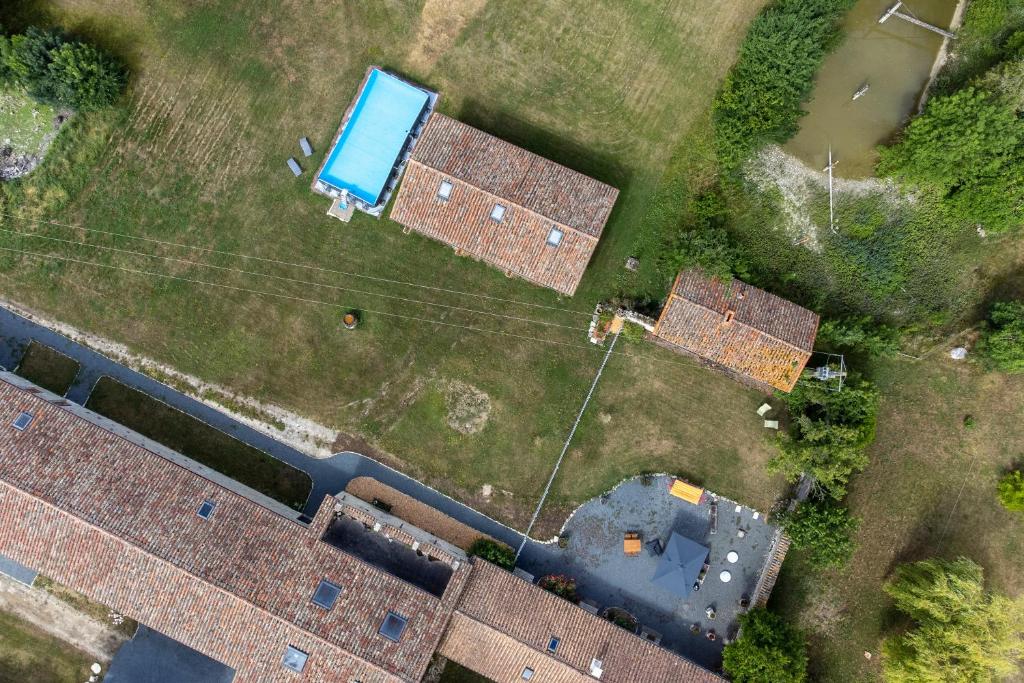 an overhead view of roofs of buildings in a field at Gîtes de la Bernière in Brûlain
