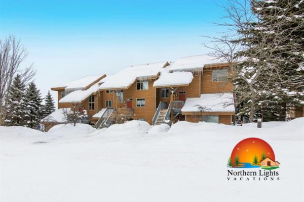 a house in the snow in front at Skier's Slopeside Haven in Bellaire