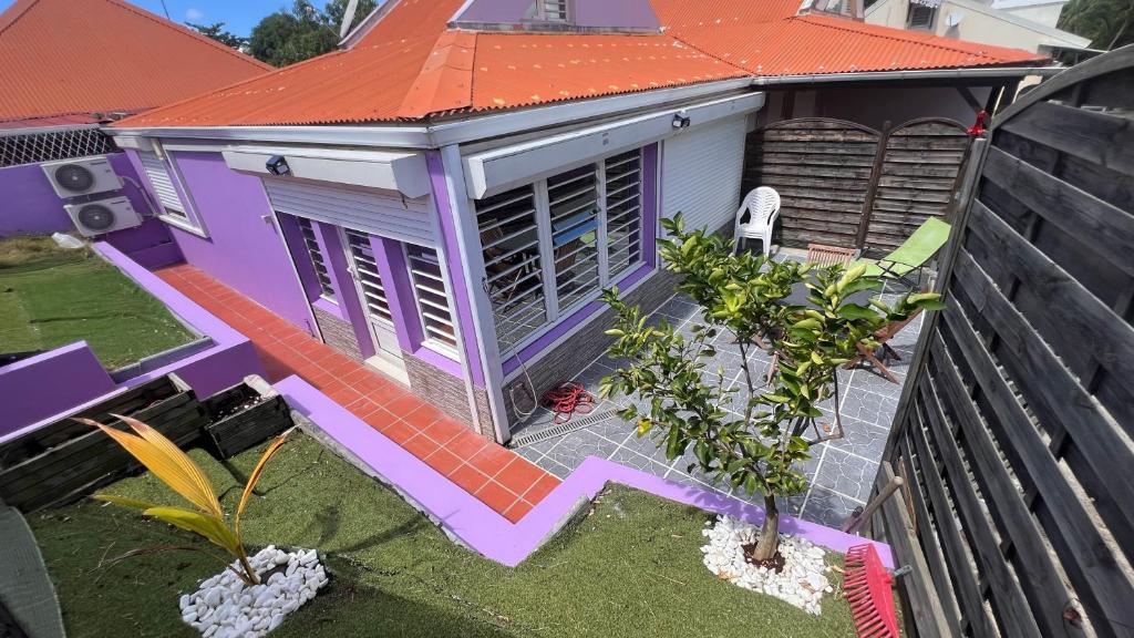 an overhead view of a house with an orange roof at Maelya House in Sainte-Anne