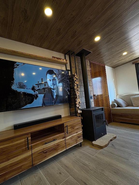 a living room with a flat screen tv on a wall at Welcome to our home in Beirut