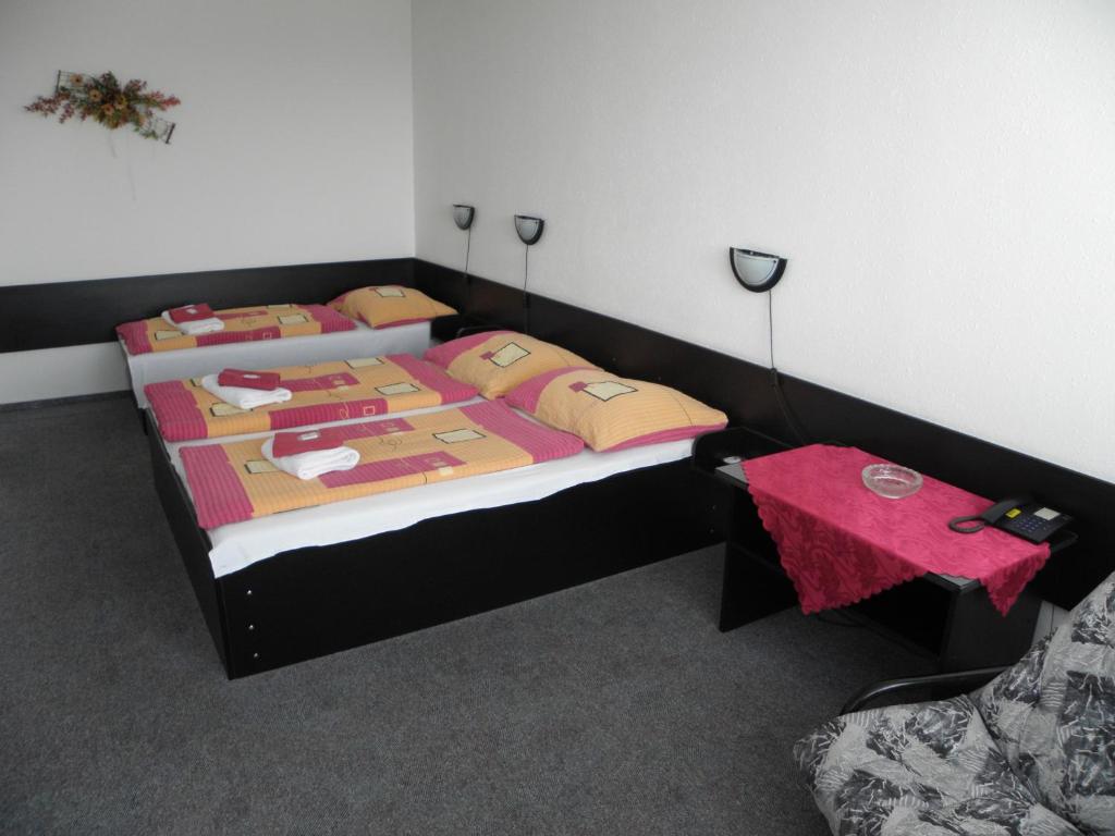 Postel nebo postele na pokoji v ubytování Hotel Milotel