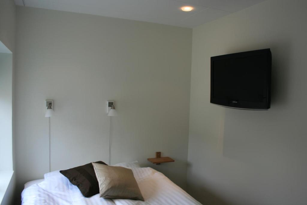 TV a/nebo společenská místnost v ubytování Flygplatshotellet
