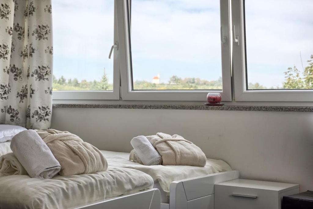 Postel nebo postele na pokoji v ubytování Gril Ranca pod Pohorjem