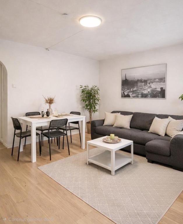 a living room with a couch and a table at Apartment 3 Sea Centrum Stavanger in Stavanger