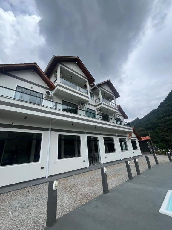 a large white building with a lot of windows at Castel Luz in Angelina