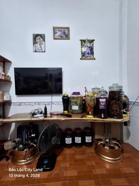 a table with jars of food on top of it at Lương Y Trần Thúy Liên in Bảo Lộc