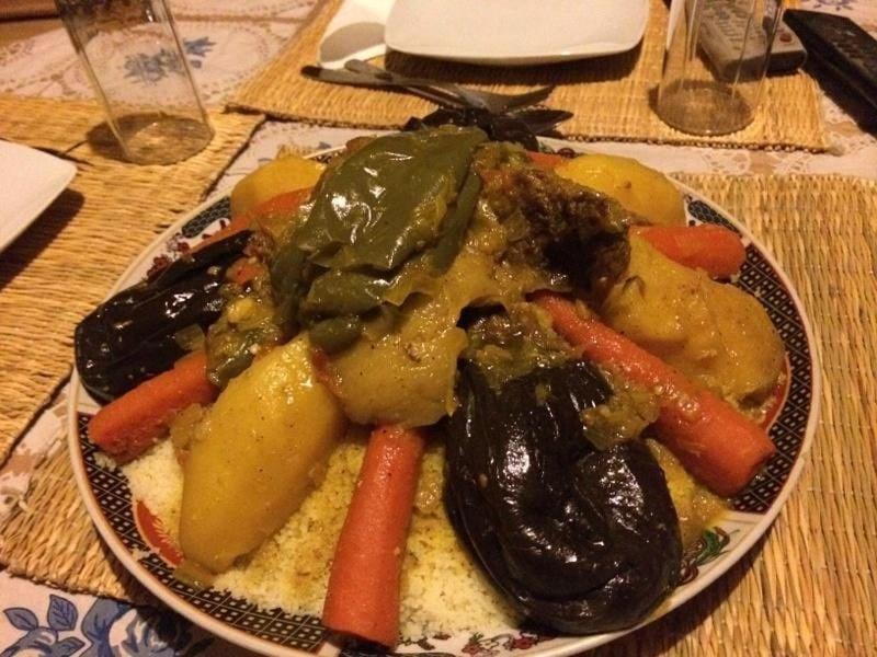 a plate of food with vegetables on a table at Kasbah des roses in Aït Saïd