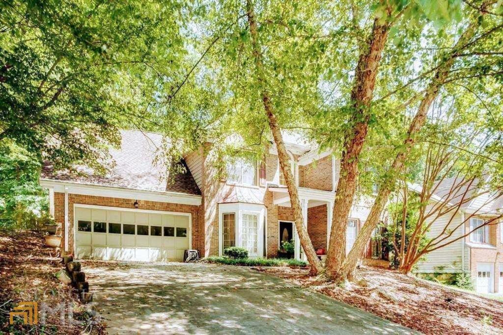 a large brick house with a garage at Southern Charmer in Stone Mountain