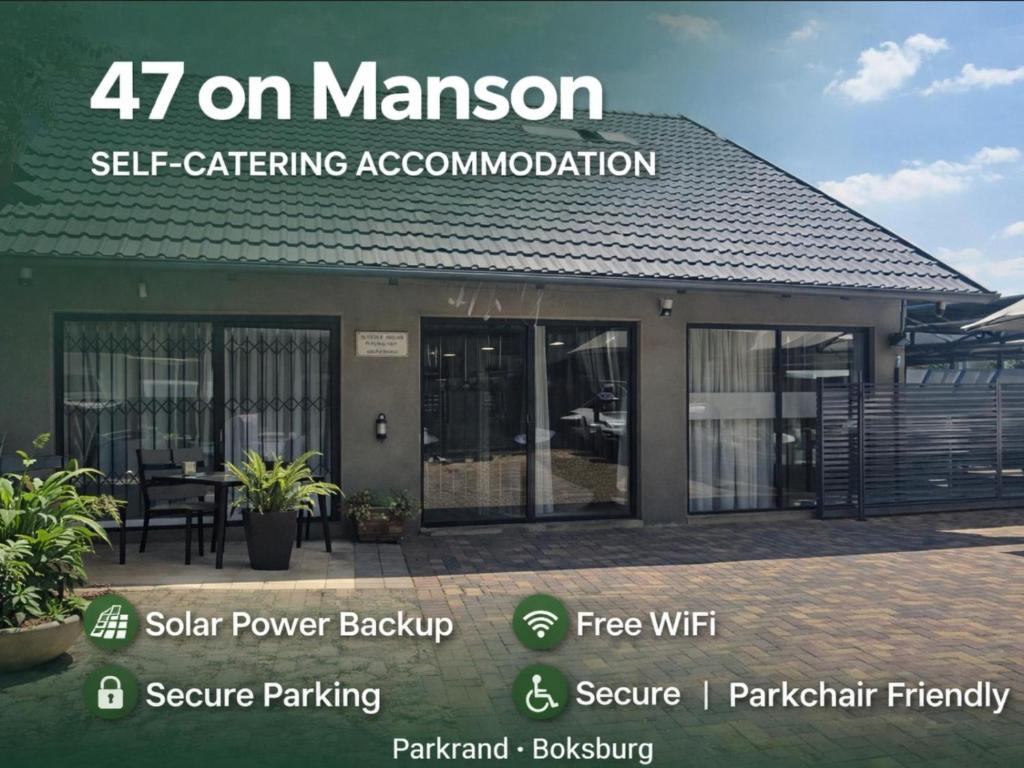 a building with a sign that reads on manson self catering accommodation at 47 on Manson in Boksburg