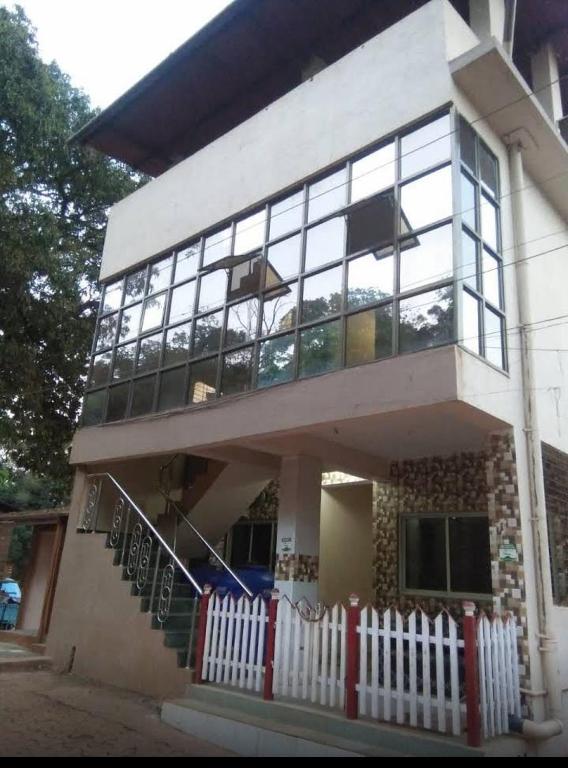 a house with a white fence in front of it at Sky cottage in Jāmb