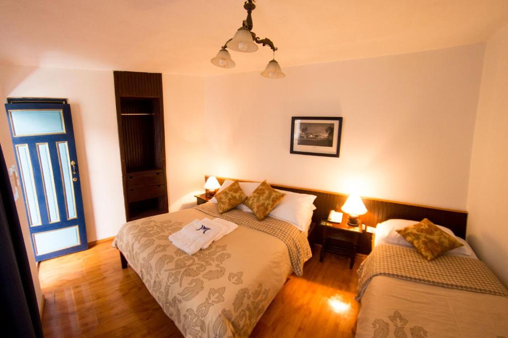 Postel nebo postele na pokoji v ubytování Hotel Montecarlo