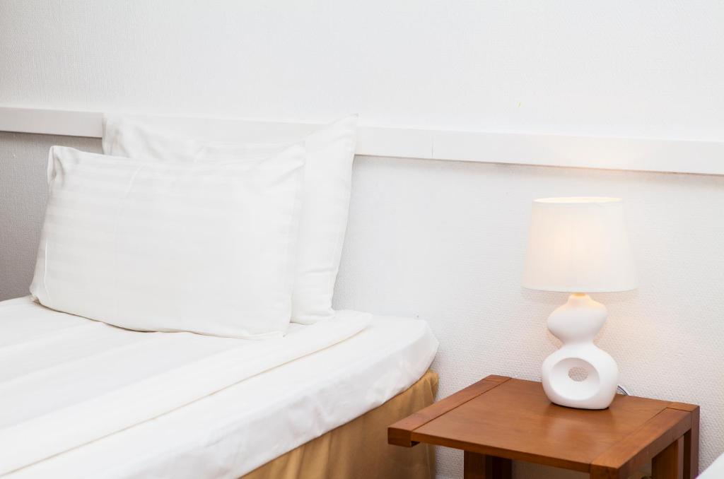 Postel nebo postele na pokoji v ubytování Hotel Expo Stockholm