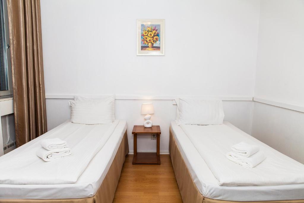 Postel nebo postele na pokoji v ubytování Hotel Expo Stockholm
