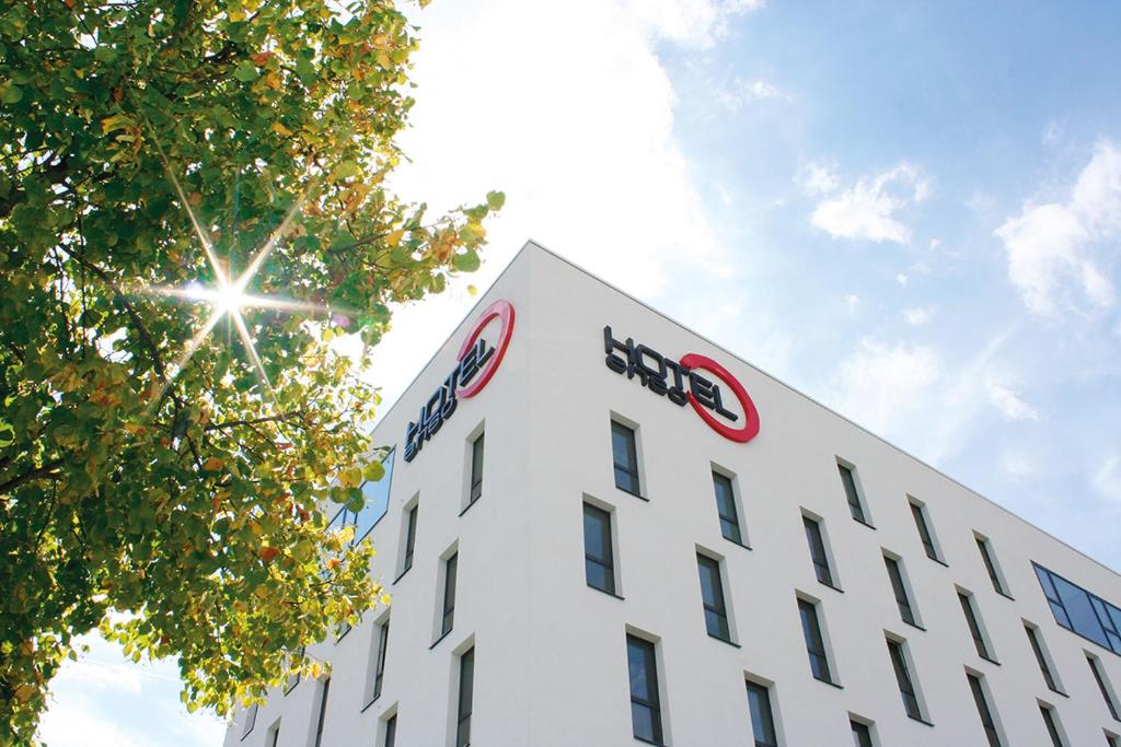 a building with the logo on the side of it at enso Hotel in Ingolstadt