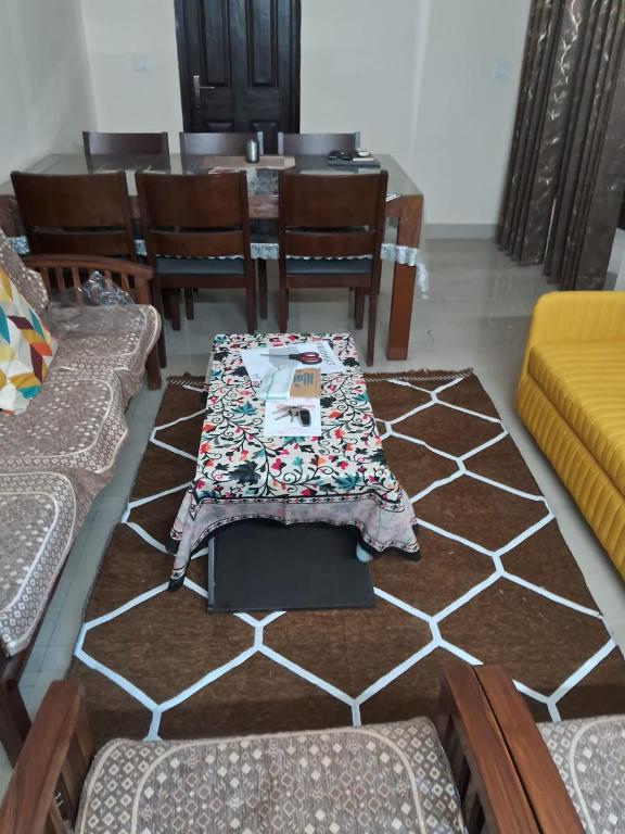 a dining room with a table and chairs at Friendly Service Apartment in Ghaziabad