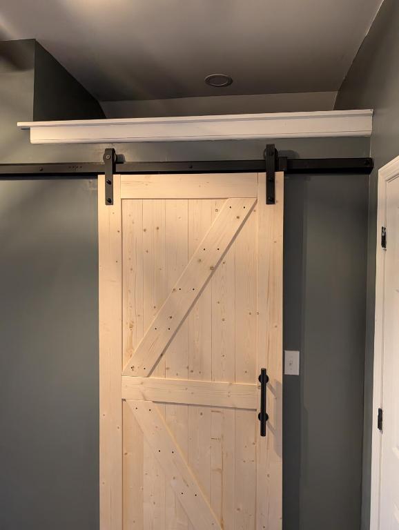 a sliding barn door in a garage at Genesis Get Away in Evergreen