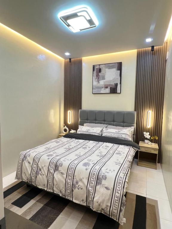 a bedroom with a large bed in a room at Eusel's Place Butuan in Butuan