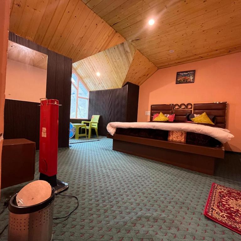 a bedroom with a large bed in a room at Ilhaan Resort Sonamarg in Sonāmarg