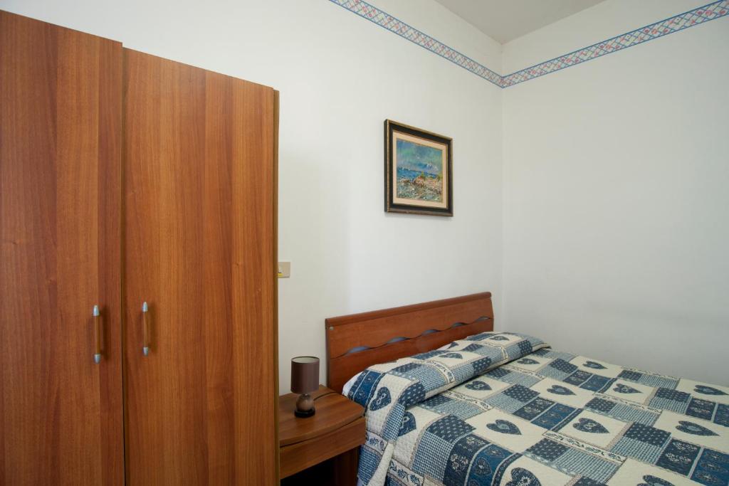 Postel nebo postele na pokoji v ubytování Albergo Pensione Ardenza SELF CHECK-IN