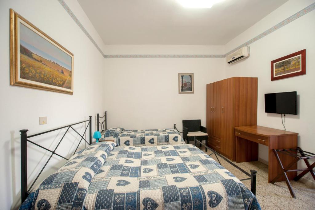 Postel nebo postele na pokoji v ubytování Albergo Pensione Ardenza SELF CHECK-IN