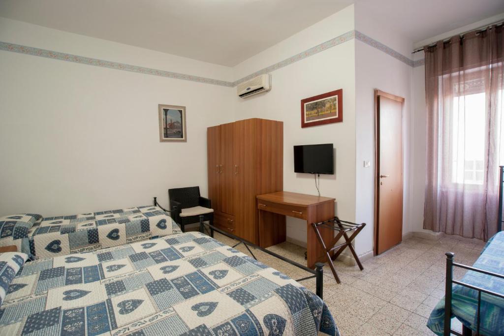 Postel nebo postele na pokoji v ubytování Albergo Pensione Ardenza SELF CHECK-IN
