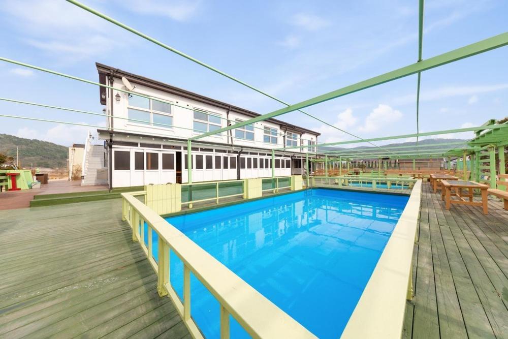 a large swimming pool on top of a building at Abientot Spa Pension Ganghwa in Incheon