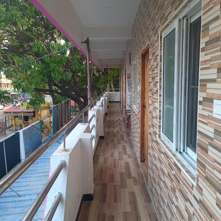 a row of benches on the side of a building at Durga Residency in Alāndurai