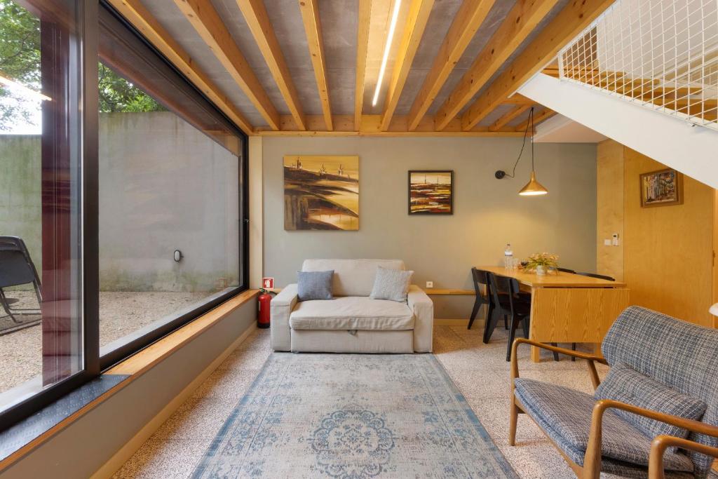 a living room with a couch and a table at Orange Apartments A in Porto