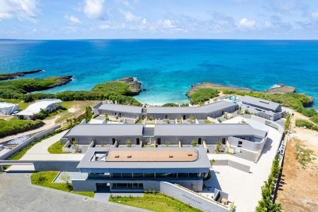 an aerial view of a building next to the ocean at アルカディアリゾート宮古島 in Irabu