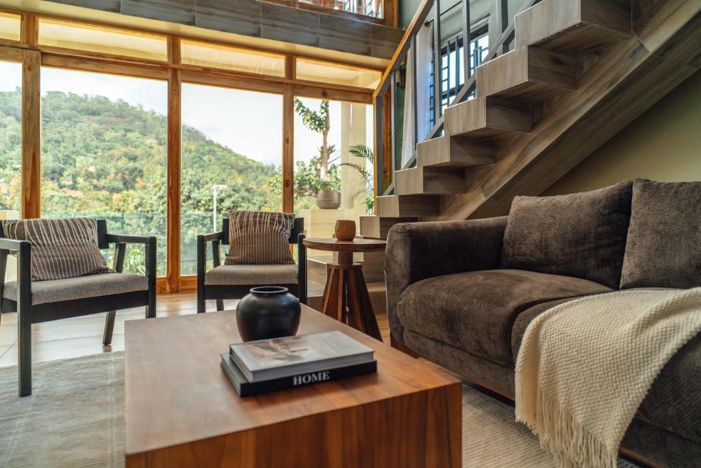 a living room with a couch and a table at Starico Residence in Nkoanrua