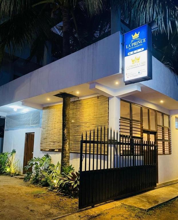 a building with a sign on the side of it at LA PRINCE HOTEL and HOSTEL in Trincomalee