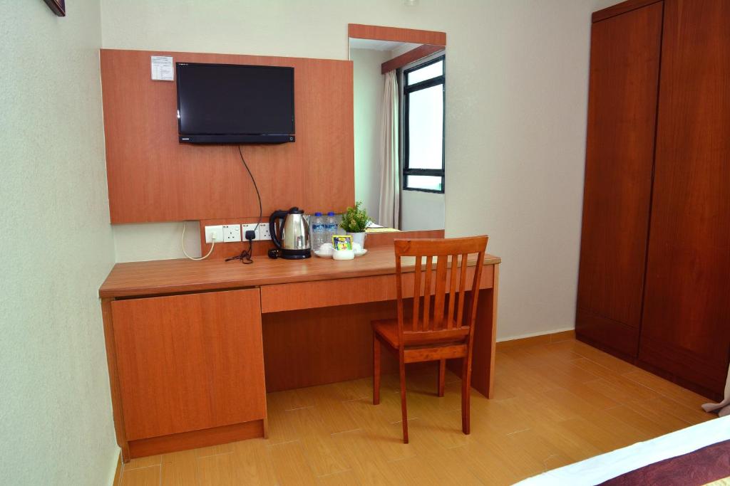 Kuchyň nebo kuchyňský kout v ubytování Muarar 99 Hotel