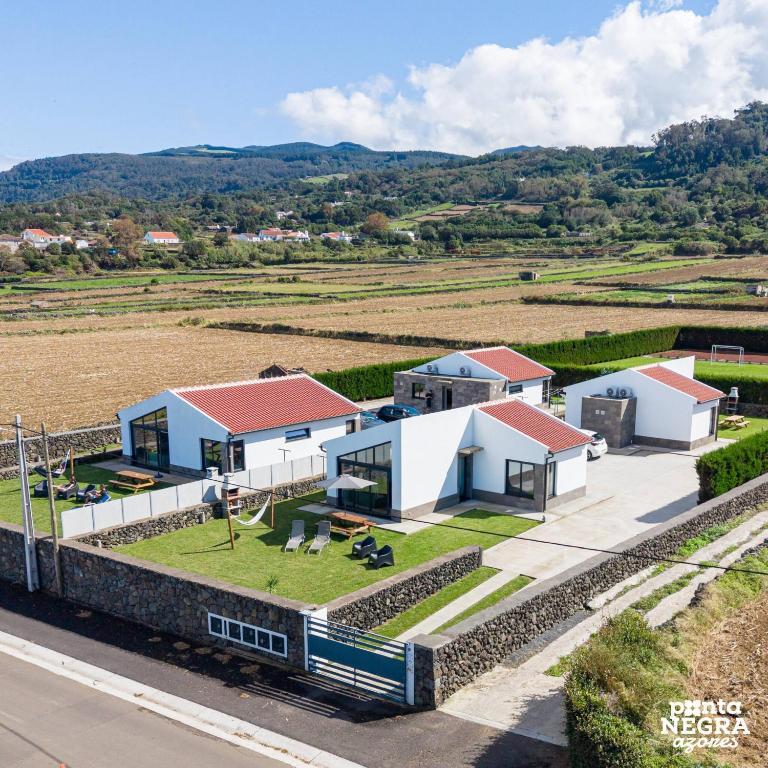 an aerial view of a house with a yard at Photography House by PontaNegraAzores in Altares