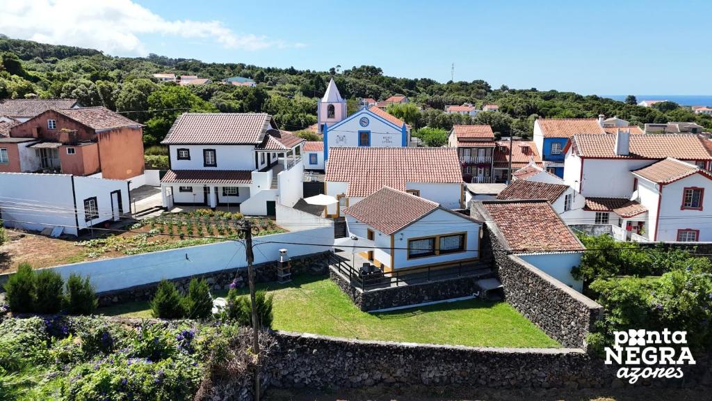 an aerial view of a small town with houses at Casa da Gente by PontaNegraAzores in Biscoitos
