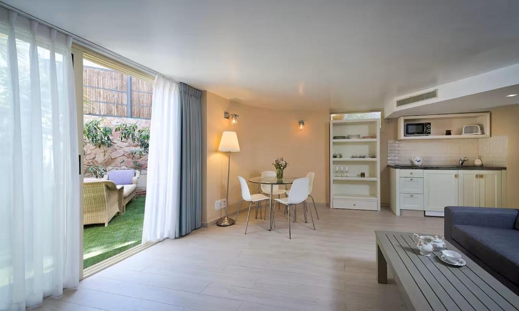 a living room with a couch and a table at Noa's Place in Eilat