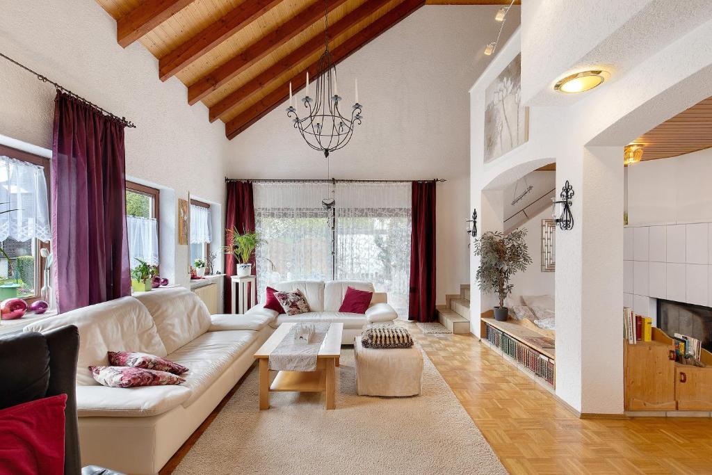 a living room with a couch and a table at Haus Domblick in Gückingen