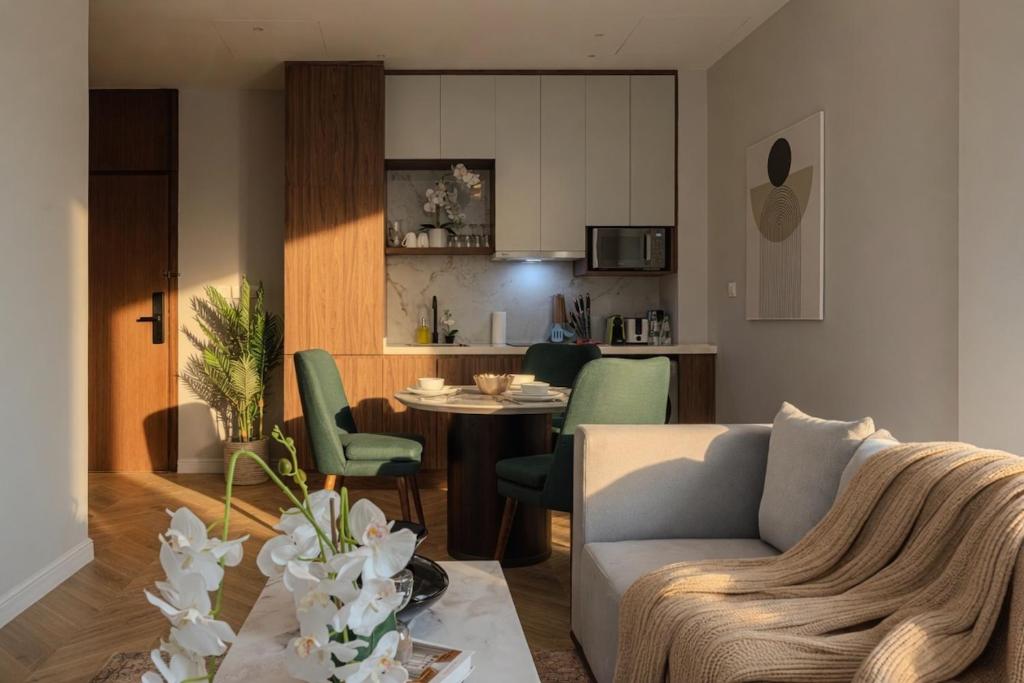 a living room with a couch and a table at Stella Stays King Fahd - Furnished Apartments in Riyadh