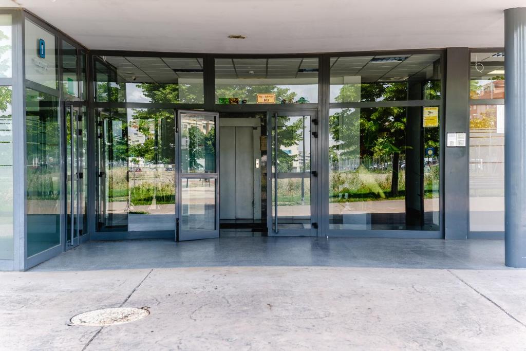 an entrance to an office building with revolving doors at Micampus Logroño Student Residence in Logroño