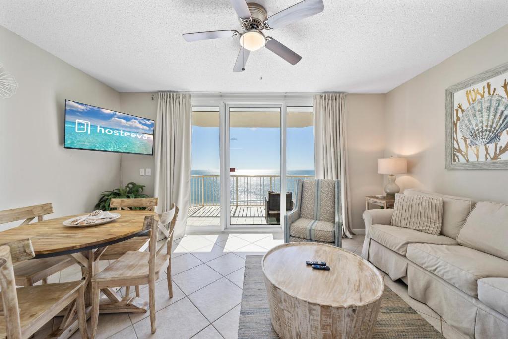 a living room with a couch and a table at Beach Club 1109 D in Gulf Shores